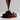 Chorro de chocolate cayendo sobre un montón de pasas oscuras, resaltando el proceso artesanal de Mysuplify.